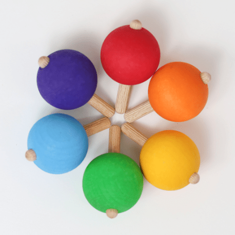 Grimm's Regenbogen Kreisel im Kreis gelegt